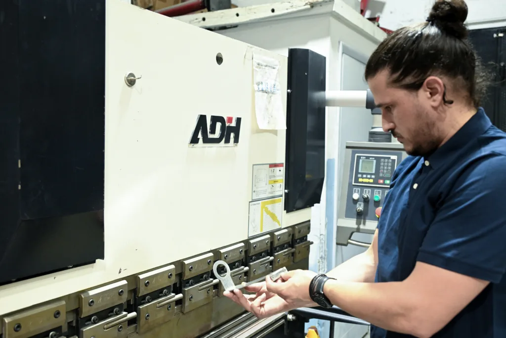 Metal bending process for custom fence fabrication at Thor Metal Art