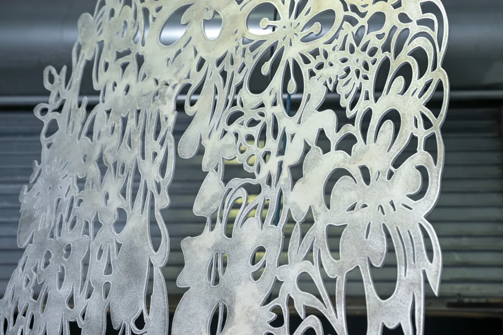 Precision-cut steel plate at Thor Metal Art fabrication shop