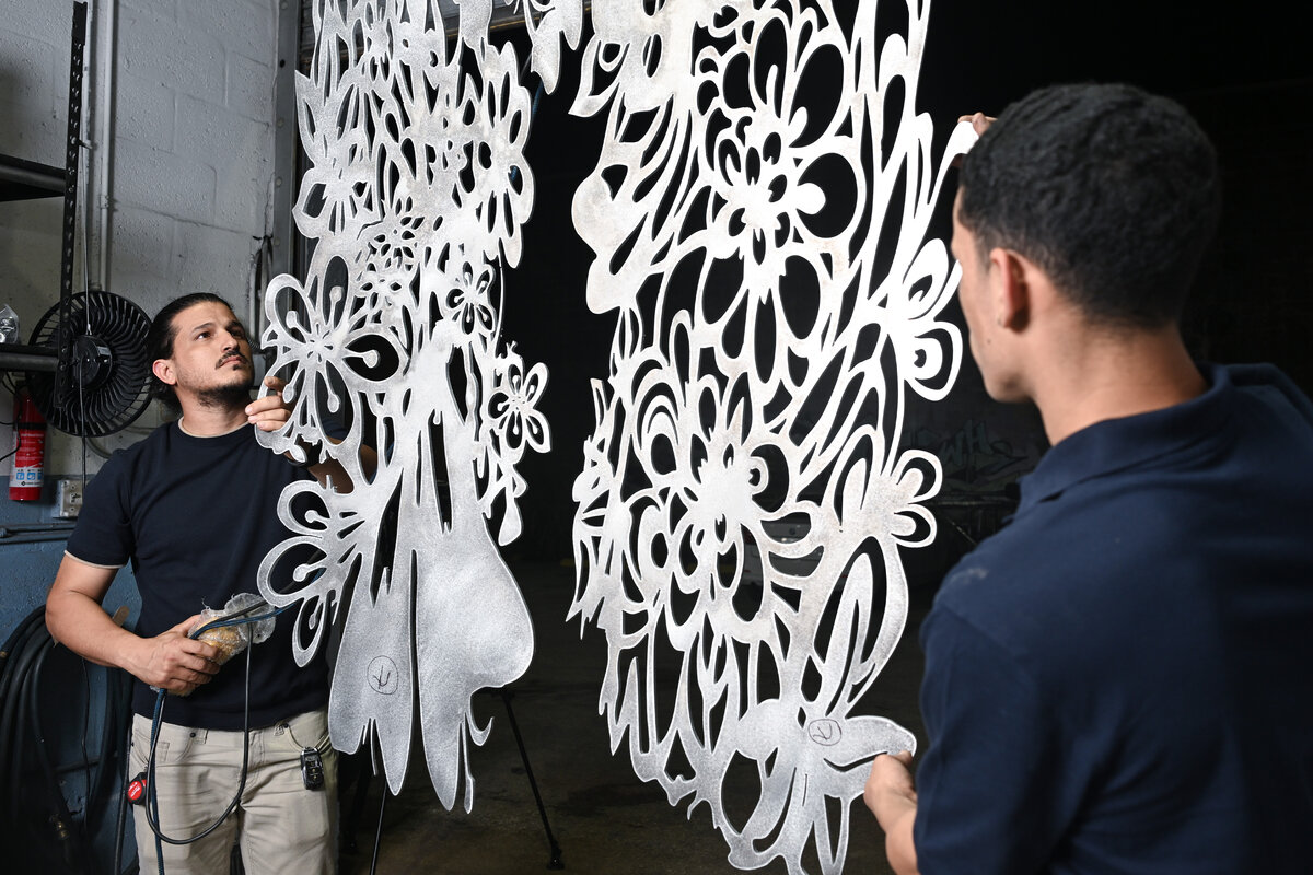 Karel Frometa at Thor Metal Art workshop with custom decorative metal panels